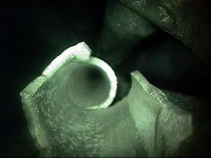 Video scopes are excellent tools for probing the shellsides of exchangers for fouling, corrosion, or other concerns. This image shows the growth of bacteria on the shellside of a cooling water exchanger. This bacteria is associated with corrosion and wall loss