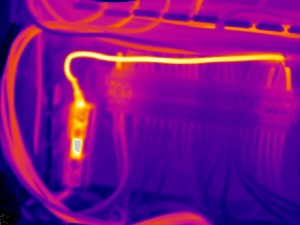 This image shows the main control panel for an extruder. The thermal anomally noted here is on the fuse block on the right hand side of the lower left fuse block. Temperatures rose to over 100° C in this area. Inspection, cleaning, and tightening of all connections and replacement of any required parts was recommended